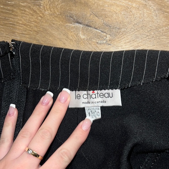 Black with white pin stripe skirt, never fit me.I’m selling it for$15 Super cute - Picture 3 of 3
